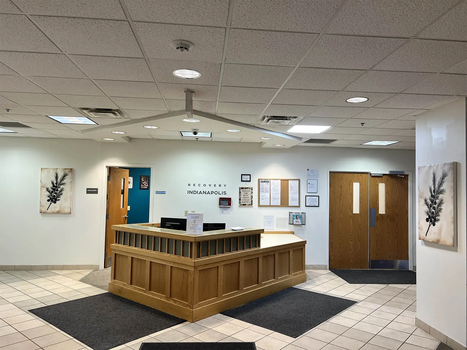 The front desk at Jasper Grove Recovery, with the intake room and a nurses' station beyond it.