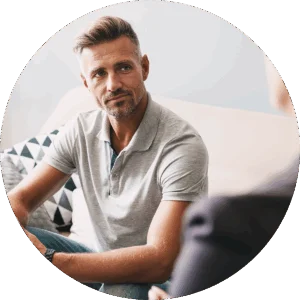 A man listens to his therapist while participating in a therapy program at Jasper Grove Recovery.