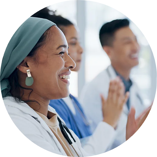 Women smiling in a clinical setting