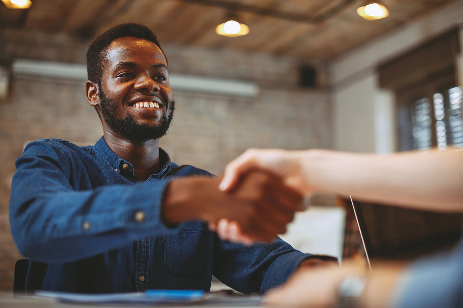 Man shaking hands with someone